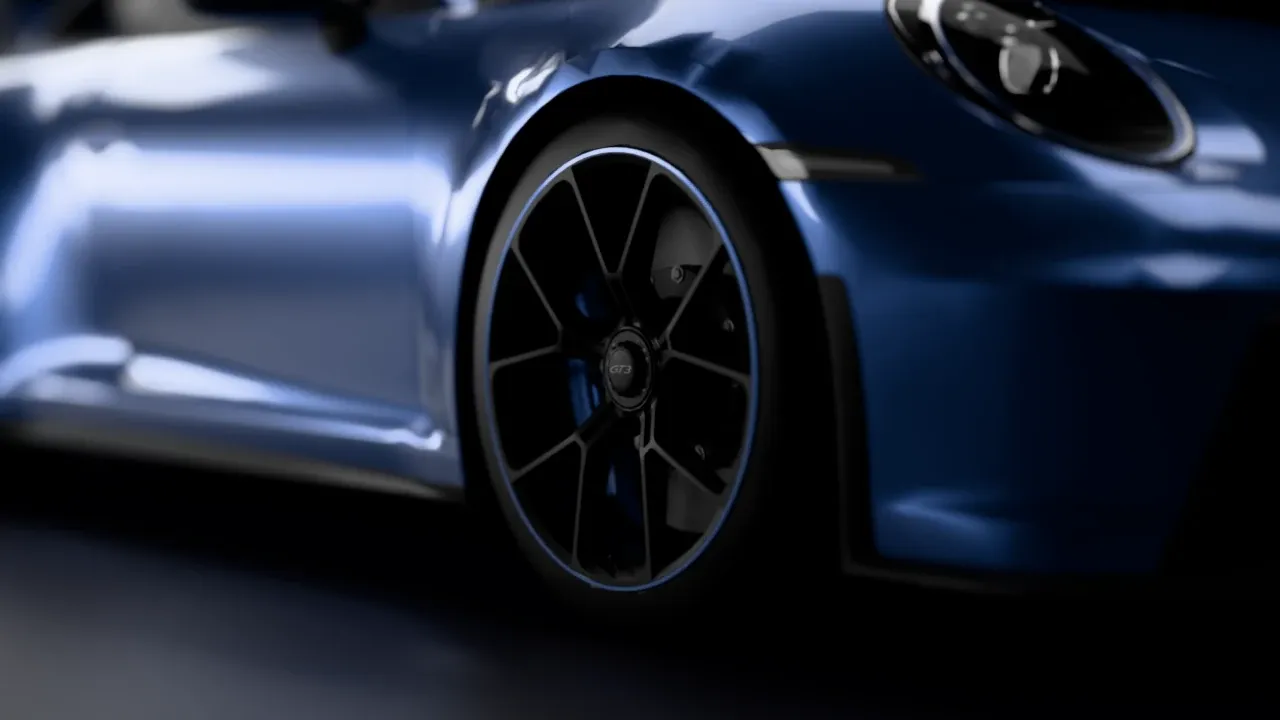 Close-up of the GT3's front wheel and brake caliper in the studio
