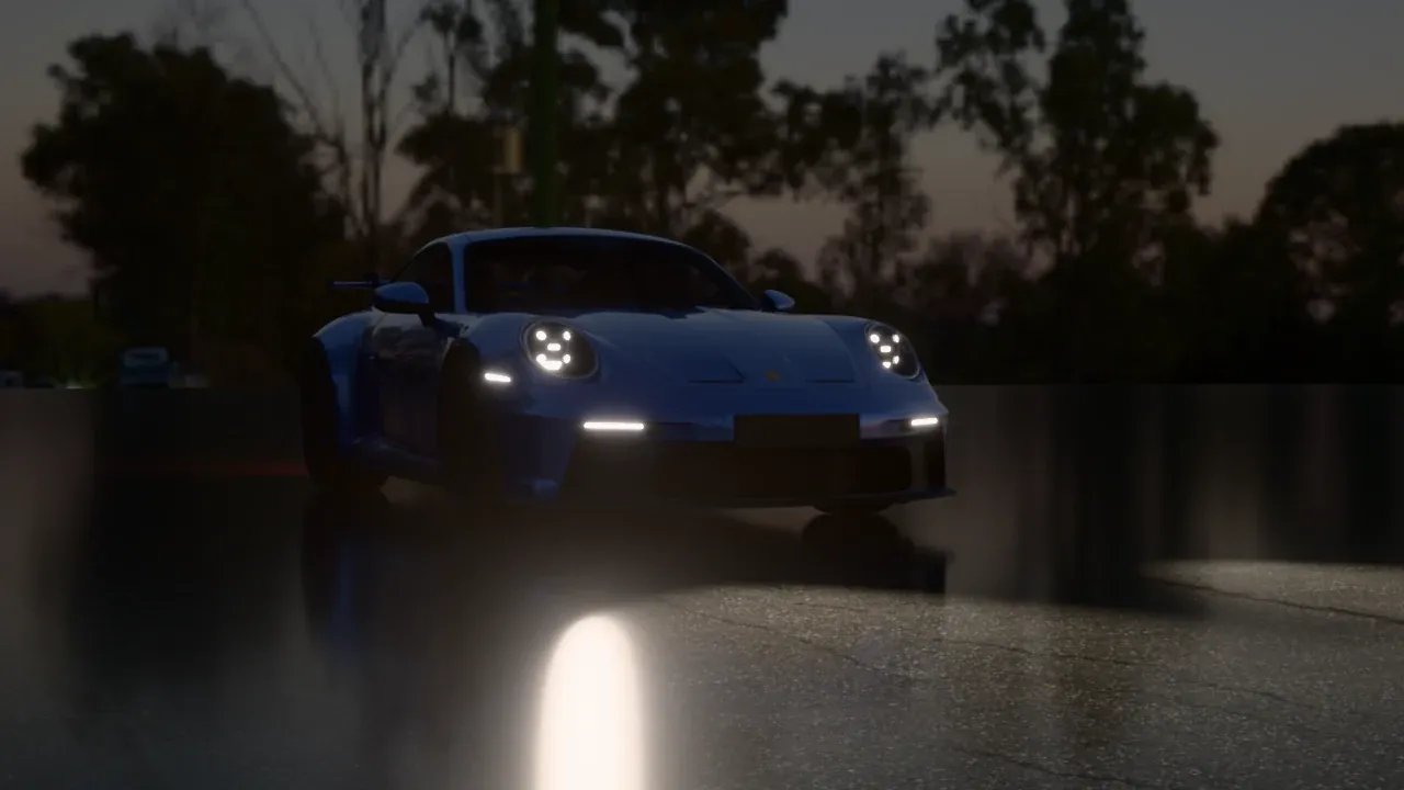 The GT3 at night on wet asphalt, its headlights and daytime running lights reflected in the road