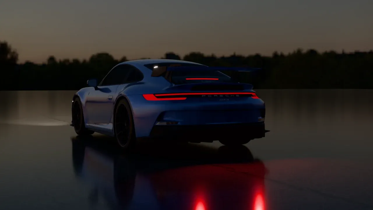The GT3 from the rear at night, its red tail light strip glowing and reflected on the wet road