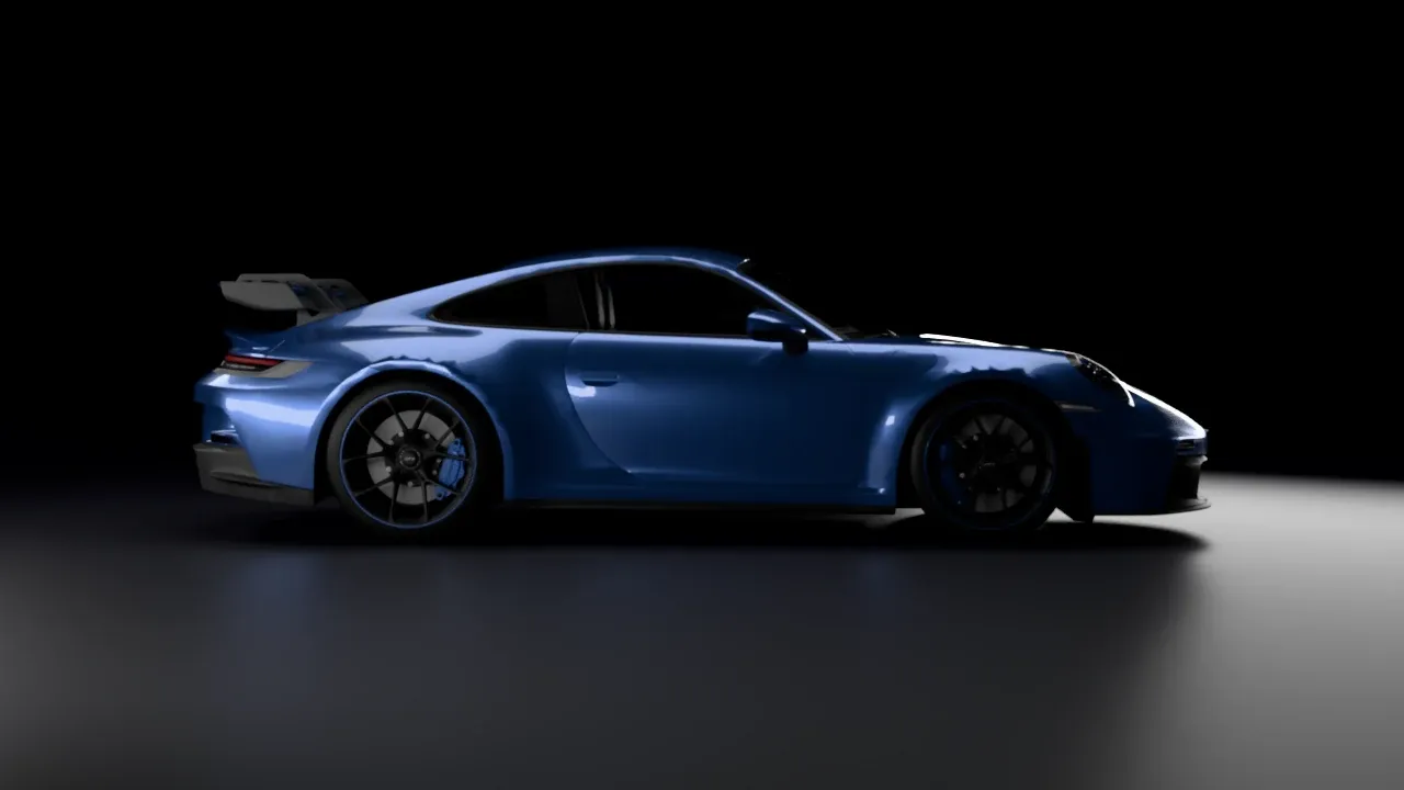 The GT3 in profile in the dark studio, with a long highlight along its side